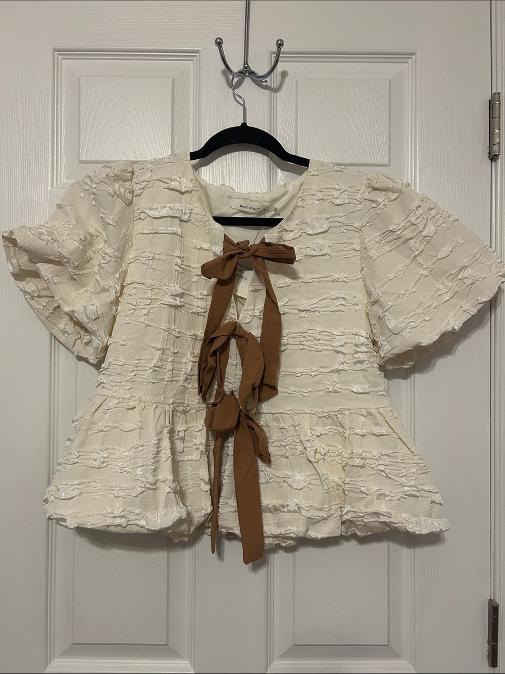 Adorable Boutique Boho Cream Textured Peplum Top with Brown Tie
